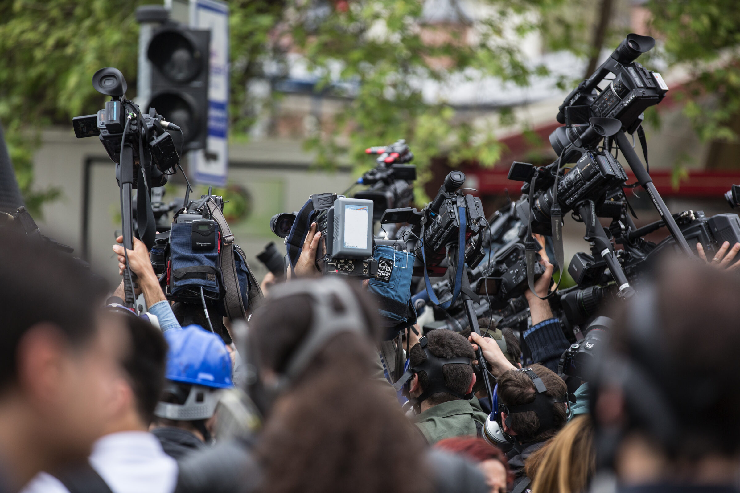 Press photographers and video journalists covering an event